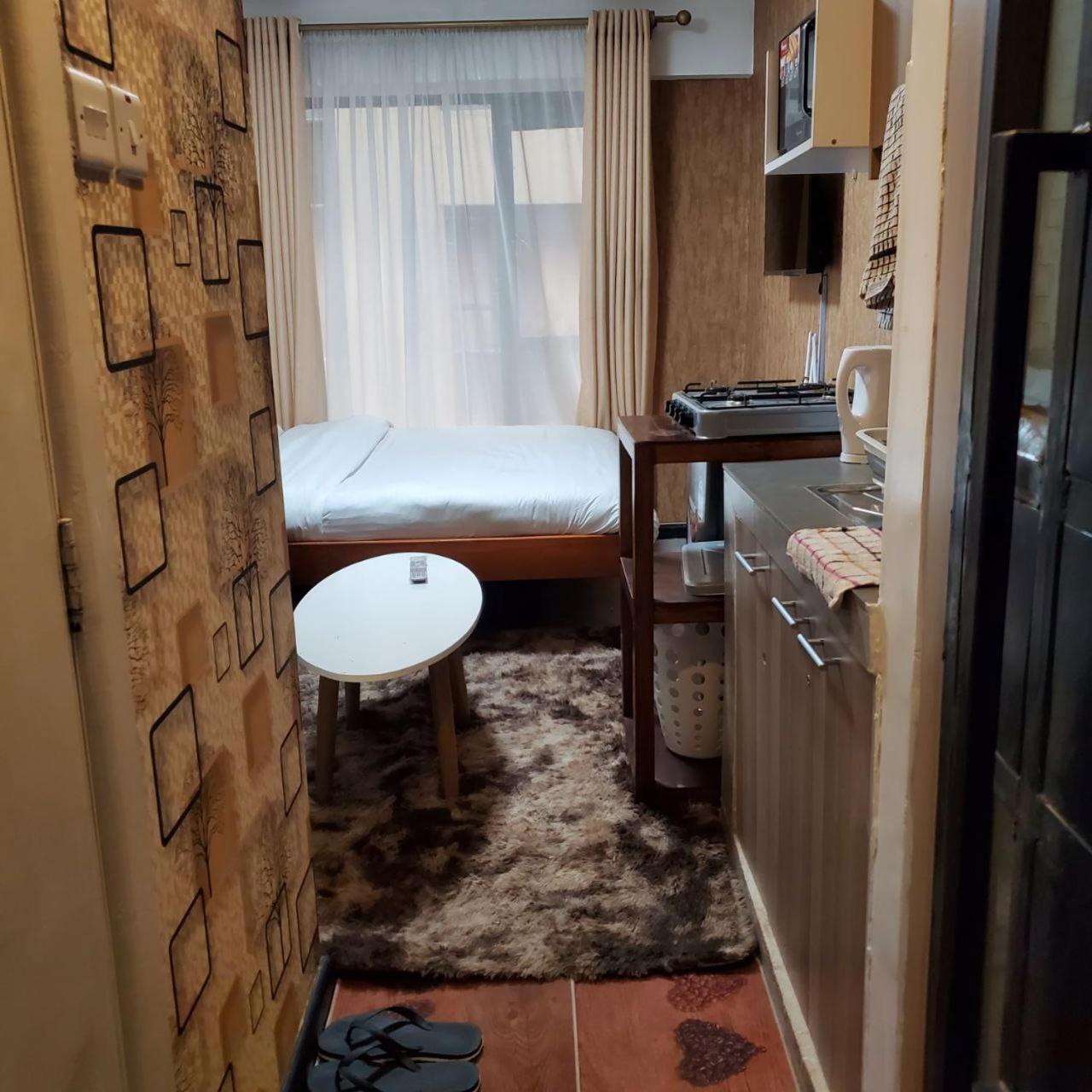 Lovely & Cozy Compact Studio Near Airport With Rooftop View Apartment ไนโรบี ภายนอก รูปภาพ
